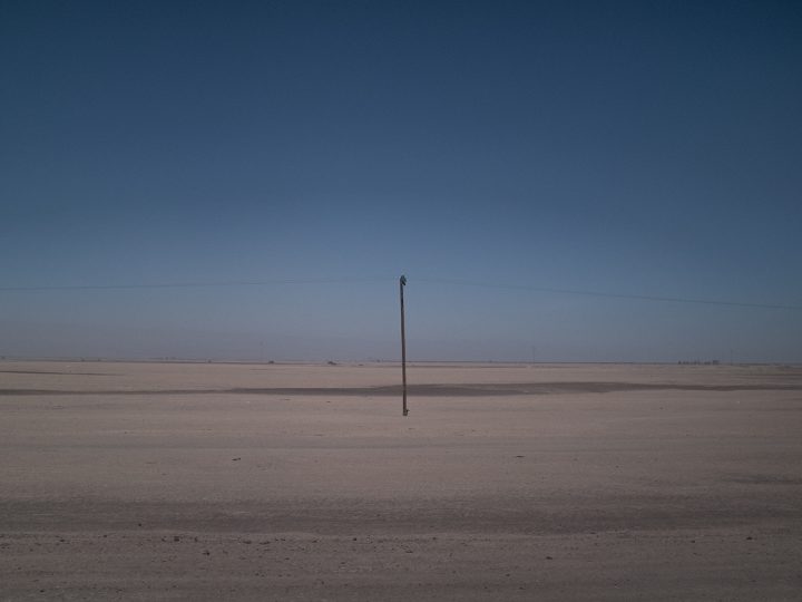 The desert road between the borders of Pisiga, Bolivia and Colchane, Chile. September 2017